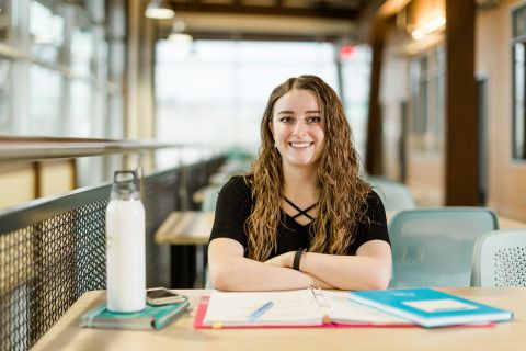 Female student studying in the Centre of Excellence building an the Penticton campus